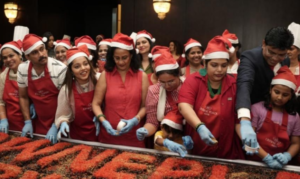IMG-Renowned Philanthropist and Managing Director of V-Star Creations Pvt. Ltd., Sheela Kochouseph and Dinesh Rai, General Manager, Crowne Plaza Kochi during the festive cake mixing ceremony at Crowne Plaza K (1)