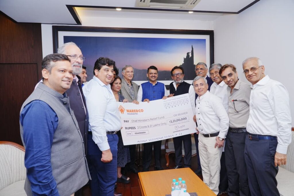 NAREDCO Maharashtra members handing over the donation cheque to Maharashtra CM Devendra Fadnavis for Chief Minister's Relief Fund
